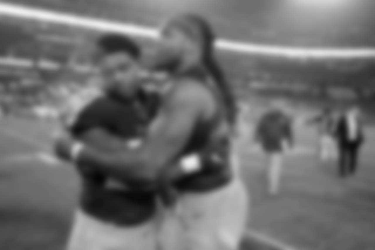 Tennessee Titans inside linebacker Jayon Brown, left, hugs running back Derrick Henry as they leave the field after an NFL football game against the Indianapolis Colts Sunday, Dec. 30, 2018, in Nashville, Tenn. The Colts won 33-17.(AP Photo/James Kenney)