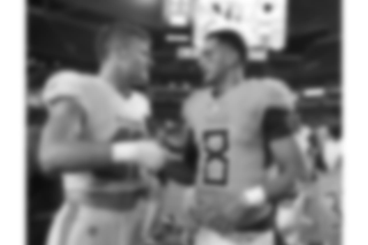 Tennessee Titans quarterback Marcus Mariota (8) speaks with Miami Dolphins linebacker Kiko Alonso (47) at the end of an NFL football game, Sunday, Sept. 9, 2018, in Miami Gardens, Fla. The Dolphins defeated the Titans 27-20. (AP Photo/Brynn Anderson)