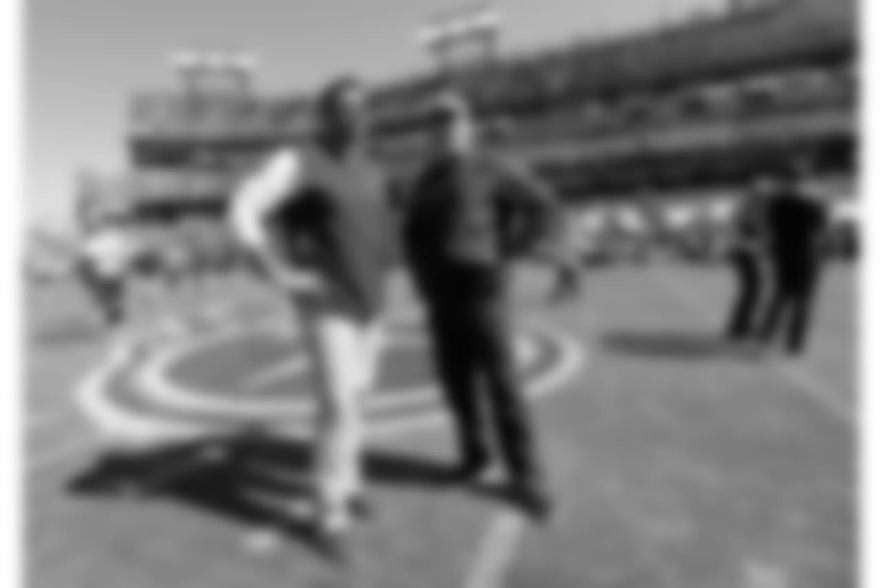 Tennessee Titans head coach Mike Vrabel, left, and Philadelphia Eagles head coach Doug Pederson talk before an NFL football game Sunday, Sept. 30, 2018, in Nashville, Tenn. (AP Photo/Mark Zaleski)