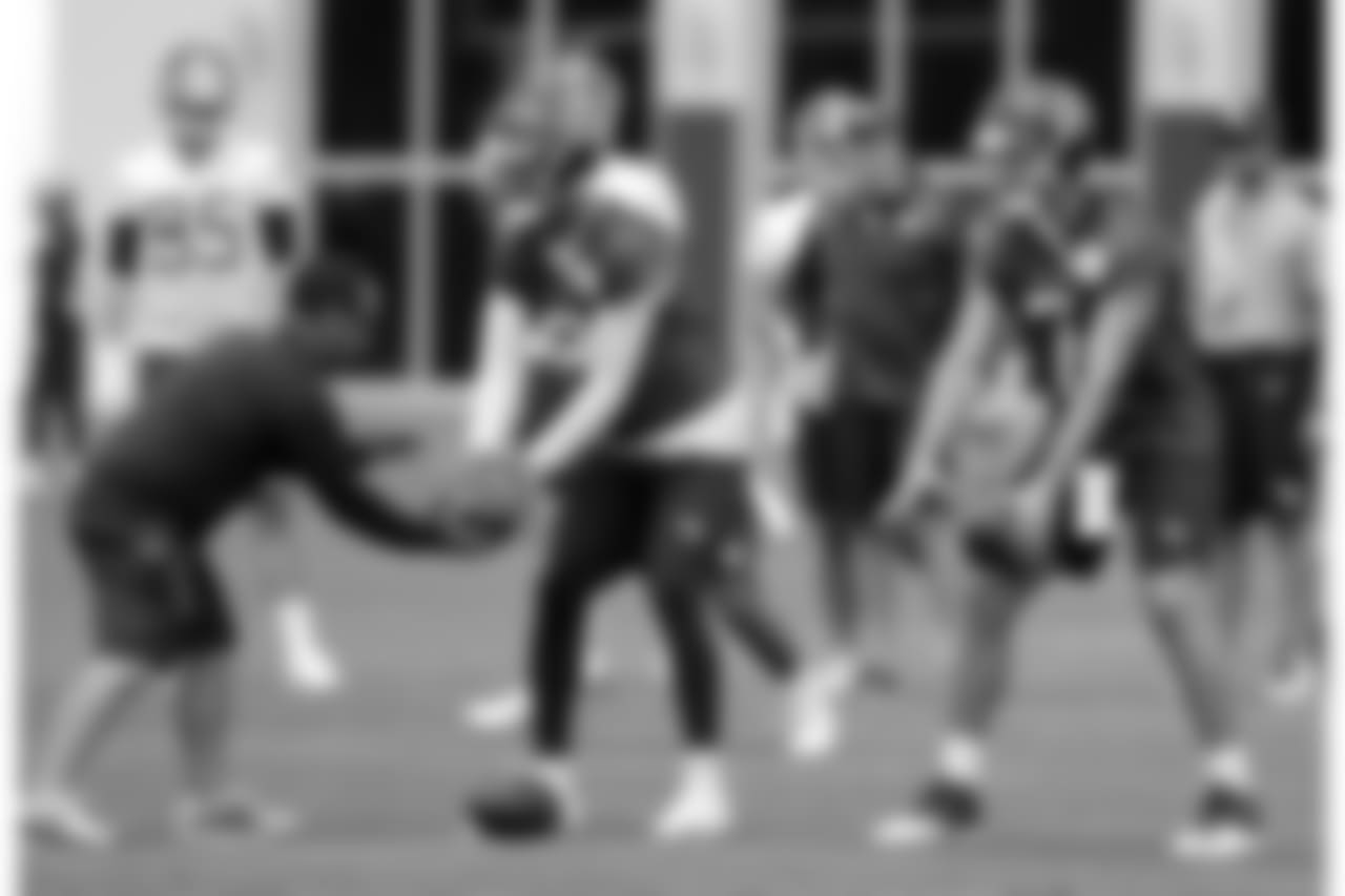 Tennessee Titans quarterbacks Marcus Mariota (8) and Blaine Gabbert (7) run a drill during an organized team activity at the Titans' NFL football training facility Wednesday, May 30, 2018, in Nashville, Tenn. (AP Photo/Mark Humphrey)