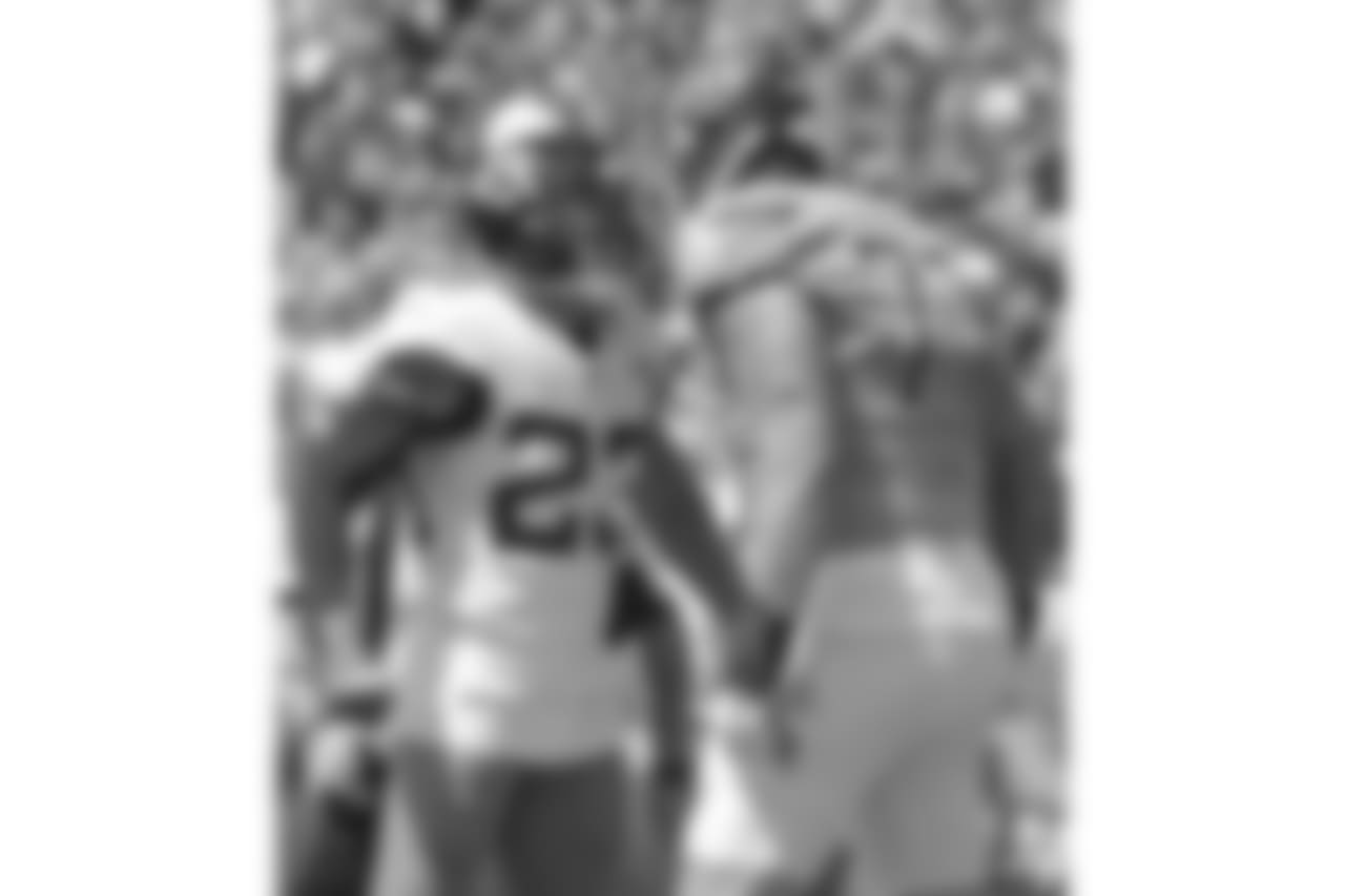 Jacksonville Jaguars defensive back Tyler Patmon (23) confronts Tennessee Titans offensive tackle Taylor Lewan (77) after a play during the first half of an NFL football game, Sunday, Sept. 23, 2018, in Jacksonville, Fla. (AP Photo/Phelan M. Ebenhack)
