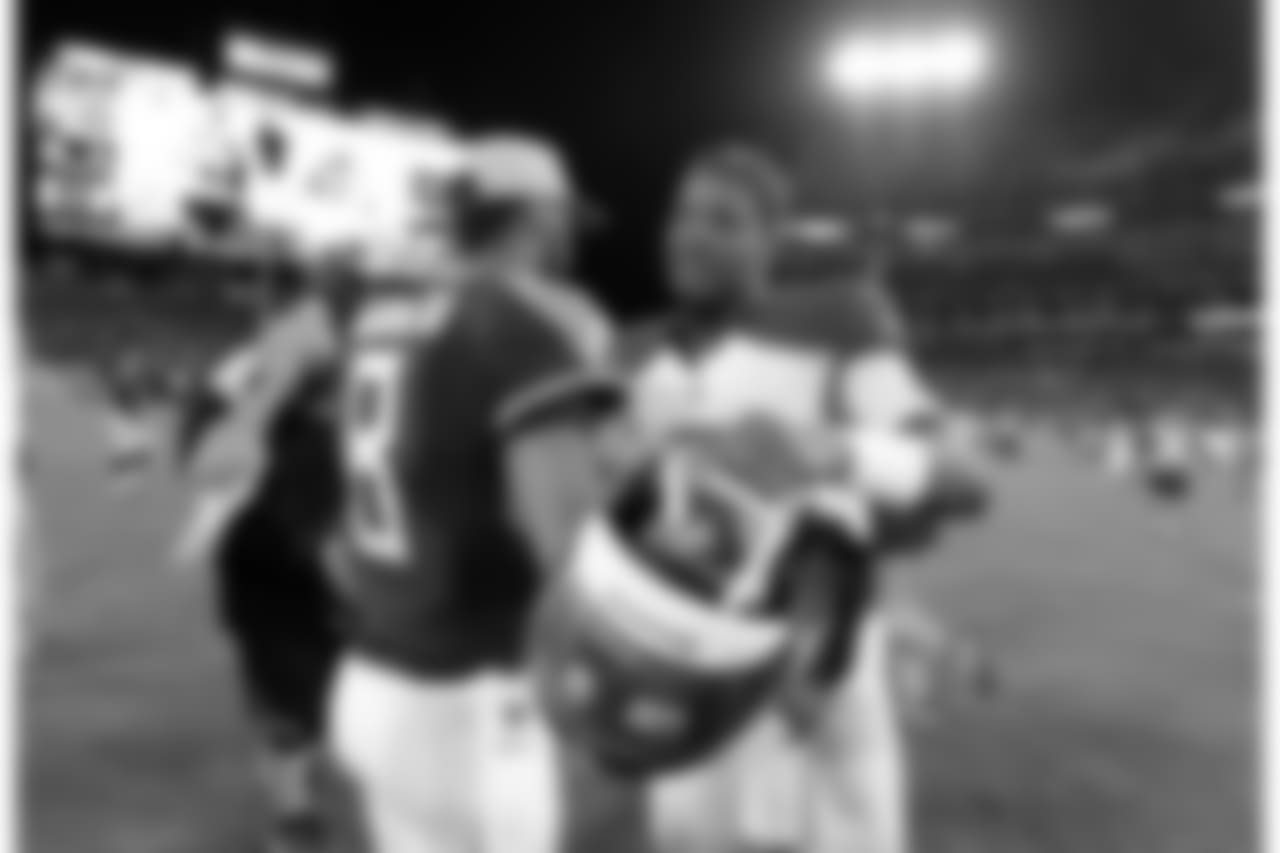 Tennessee Titans quarterback Marcus Mariota (8) meets with Tampa Bay Buccaneers quarterback Jameis Winston after a preseason NFL football game Saturday, Aug. 18, 2018, in Nashville, Tenn. The Buccaneers won 30-14. (AP Photo/Mark Zaleski)