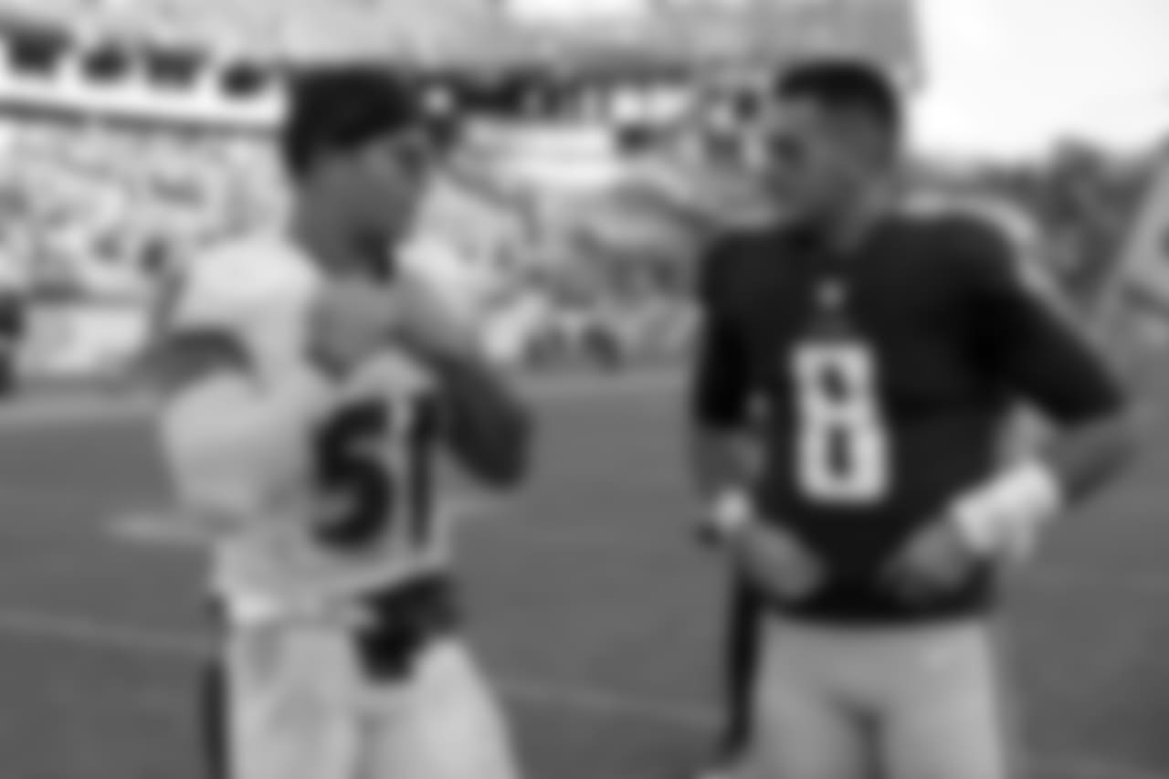 Baltimore Ravens inside linebacker Kamalei Correa (51) talks with Tennessee Titans quarterback Marcus Mariota (8) after an NFL football game Sunday, Nov. 5, 2017, in Nashville, Tenn. The Titans won 23-20. (AP Photo/James Kenney)