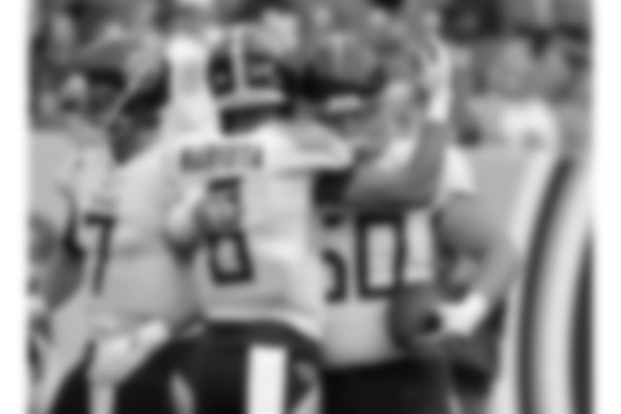 Tennessee Titans quarterback Marcus Mariota (8) hugs center Ben Jones (60) before an NFL football game between the Titans and the Houston Texans Sunday, Sept. 16, 2018, in Nashville, Tenn. (AP Photo/Mark Zaleski)