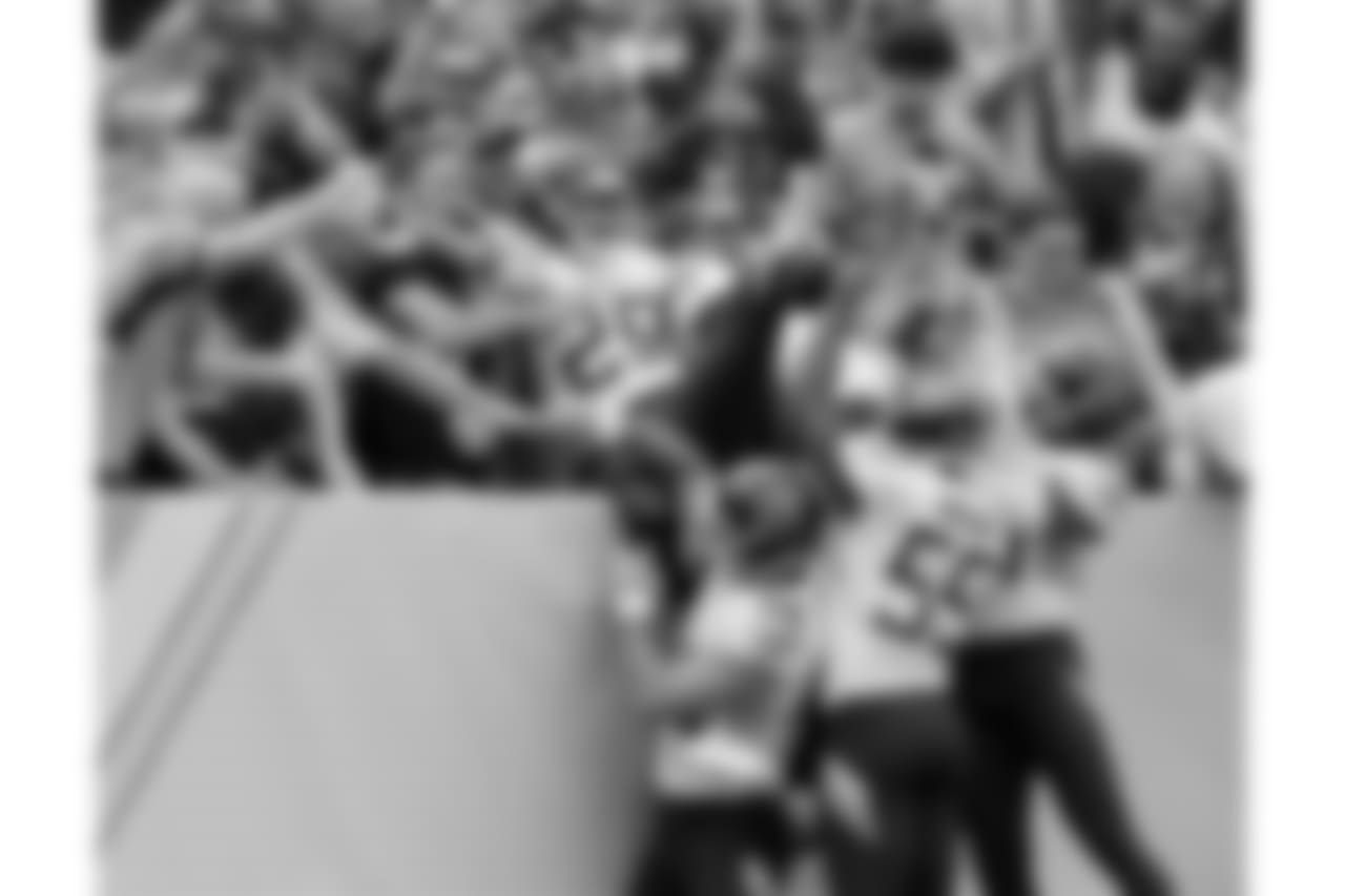 Fans and teammates celebrate with Tennessee Titans' Dane Cruikshank (29) after he scored a touchdown on a fake punt against the Houston Texans in the first half of an NFL football game Sunday, Sept. 16, 2018, in Nashville, Tenn. (AP Photo/Mark Zaleski)