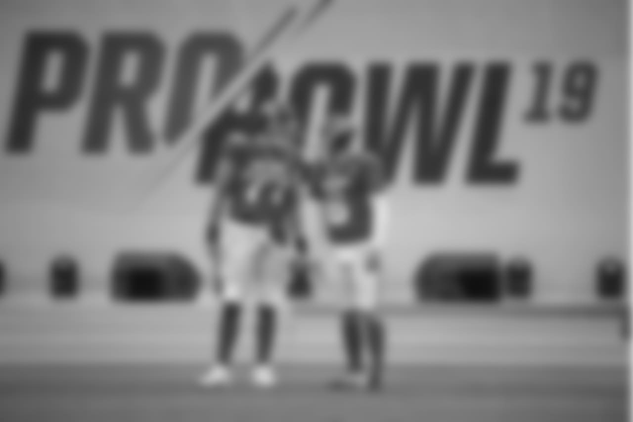 AFC offensive tackle Taylor Lewan (77) and punter Brett Kern (6), of the Tennessee Titans, wait to run onto the field during player introductions before the NFL Pro Bowl football game against the NFC Sunday, Jan. 27, 2019, in Orlando, Fla. (AP Photo/Phelan M. Ebenhack)
