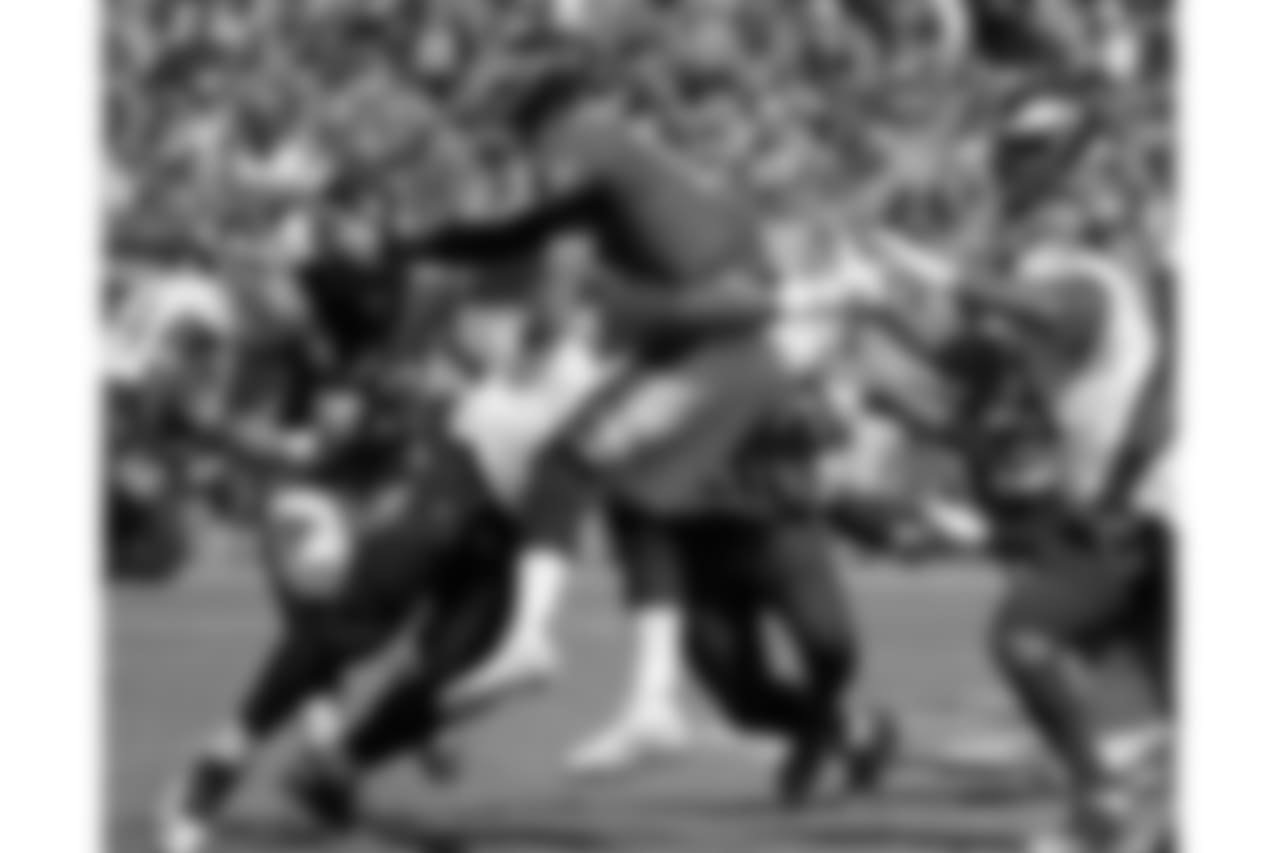 Philadelphia Eagles quarterback Carson Wentz (11) is hit as he throws a pass against the Tennessee Titans in the first half of an NFL football game Sunday, Sept. 30, 2018, in Nashville, Tenn. (AP Photo/James Kenney)