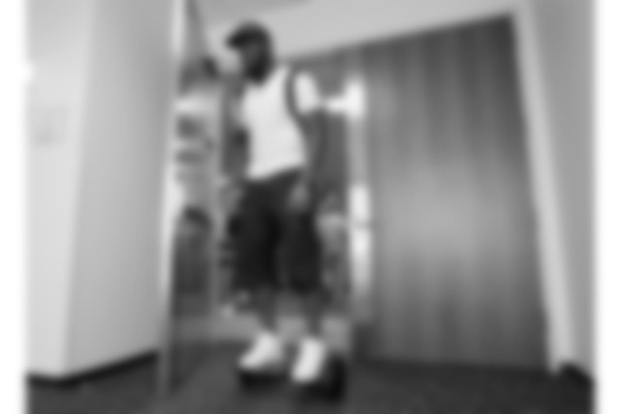 In this Wednesday, Sept. 23, 2015, photo, Tennessee Titans linebacker Brian Orakpo leaves the locker room on a motorized skateboard in Nashville, Tenn. Many of the Titans players use the devices to travel through the team's facility. (AP Photo/Mark Humphrey)