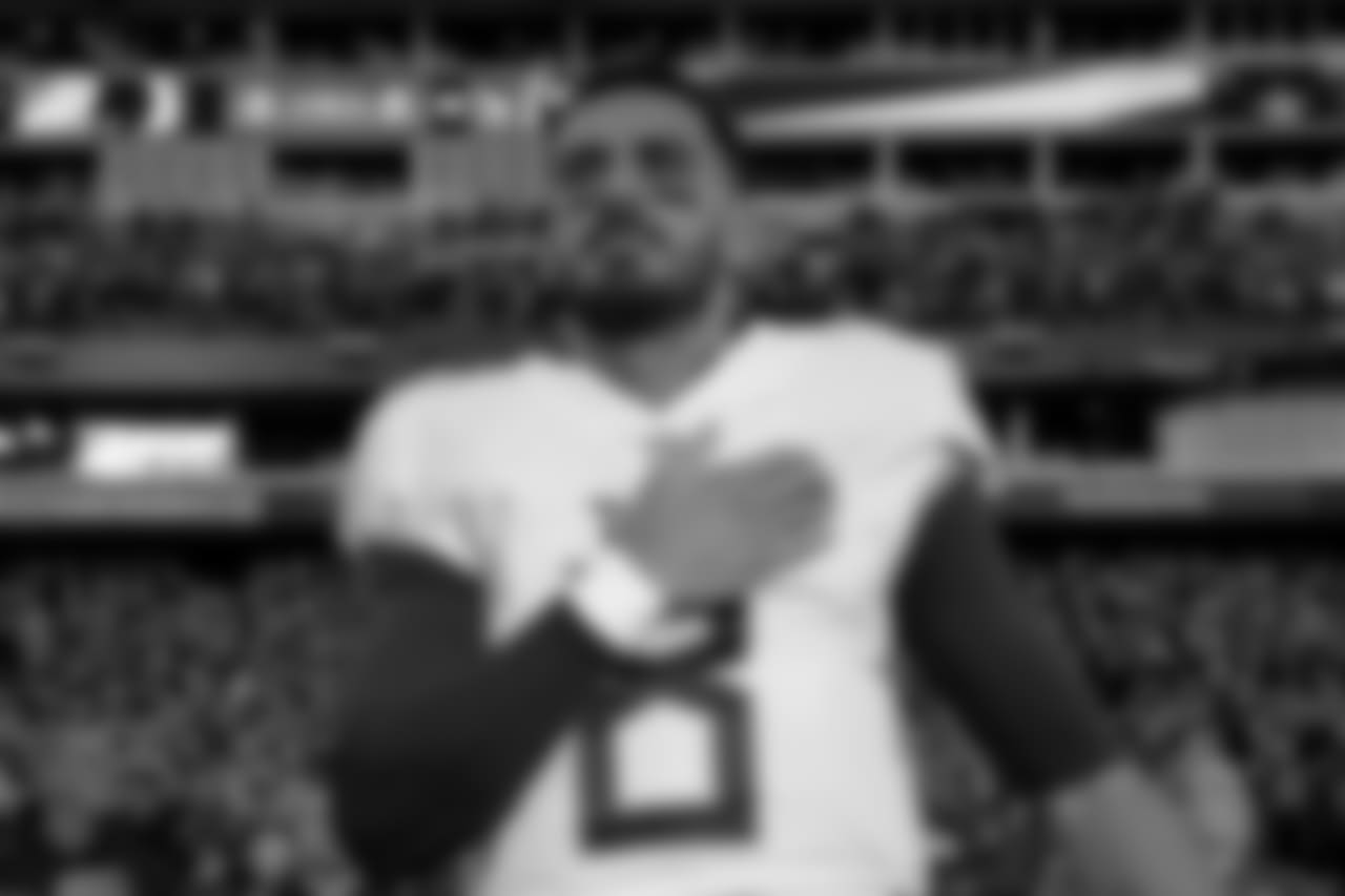 Tennessee Titans quarterback Marcus Mariota (8) stands on the field during the national anthem prior to an NFL football game against the Washington Redskins, Saturday, Dec. 22, 2018 in Nashville, TN. (Aaron Doster via AP)