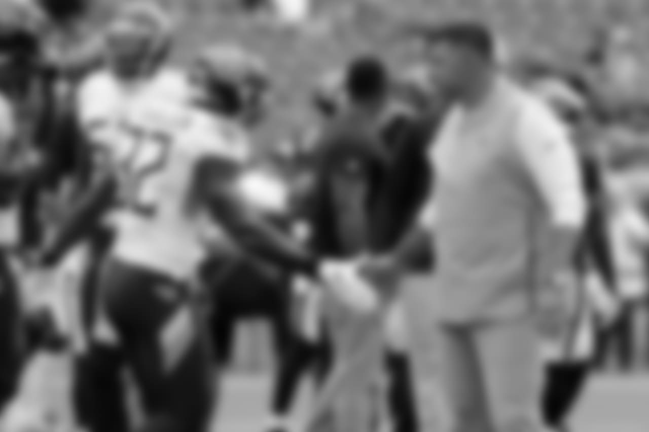 Tennessee Titans head coach Mike Vrabel shakes hands with running back David Fluellen (32) before an NFL football game between the Titans and the Houston Texans Sunday, Sept. 16, 2018, in Nashville, Tenn. (AP Photo/Mark Zaleski)