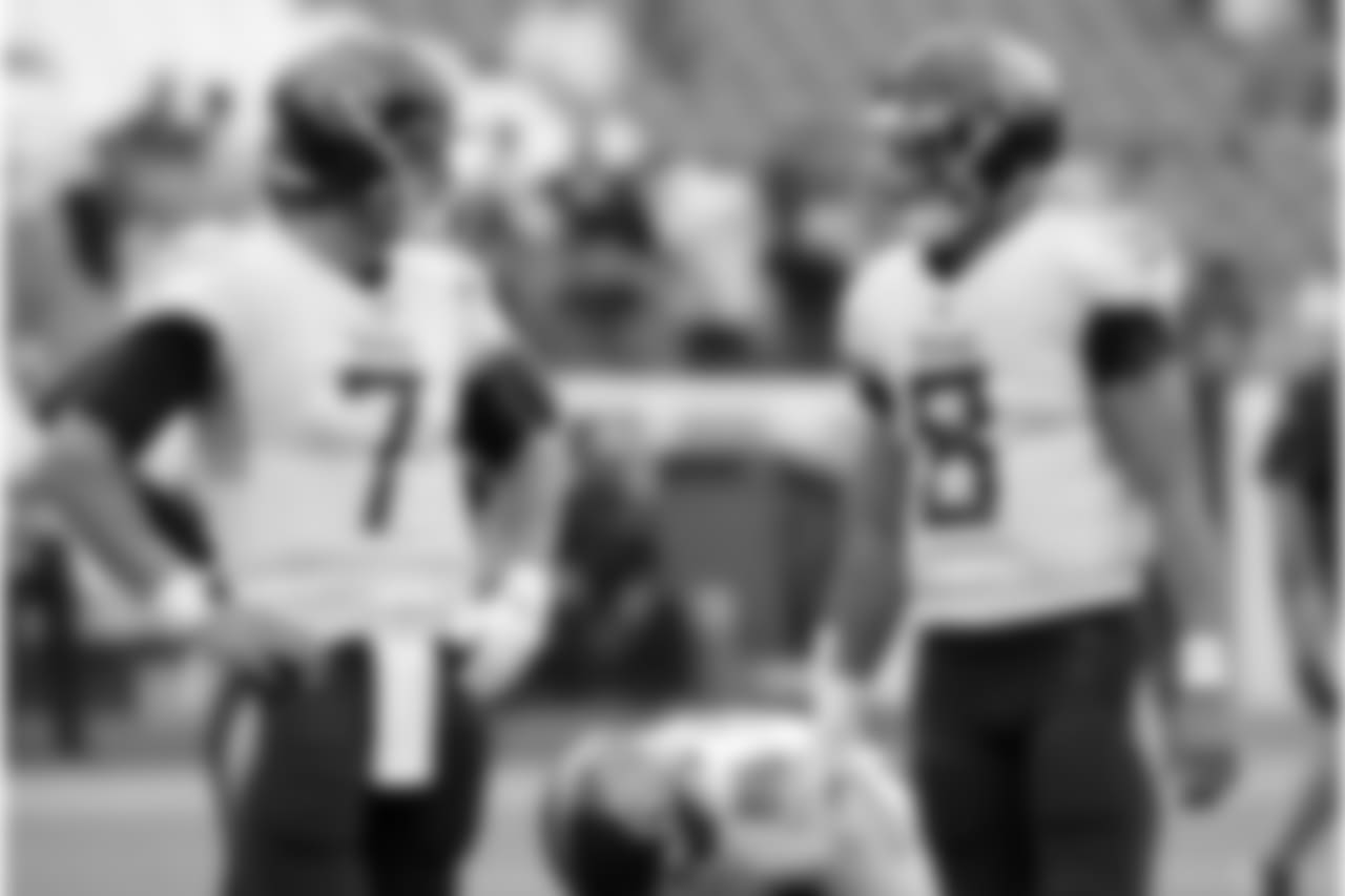 Tennessee Titans quarterbacks Blaine Gabbert (7) and Marcus Mariota (8) talk before an NFL football game against the Houston Texans Sunday, Sept. 16, 2018, in Nashville, Tenn. (AP Photo/Mark Zaleski)