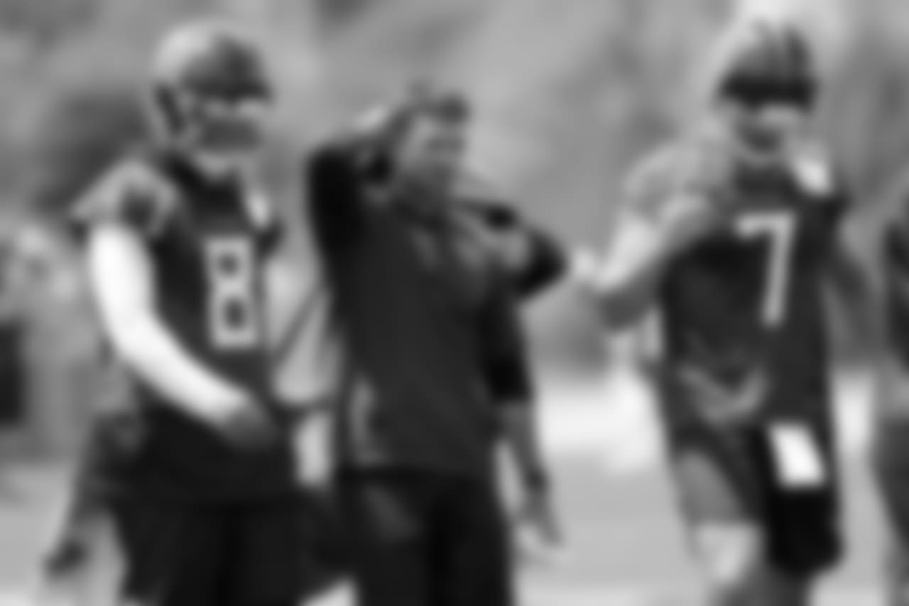 Tennessee Titans offensive coordinator Matt LaFleur, center, walks with quarterbacks Marcus Mariota (8) and Blaine Gabbert (7) during an organized team activity at the Titans' NFL football training facility Tuesday, May 22, 2018, in Nashville, Tenn. (AP Photo/Mark Humphrey)