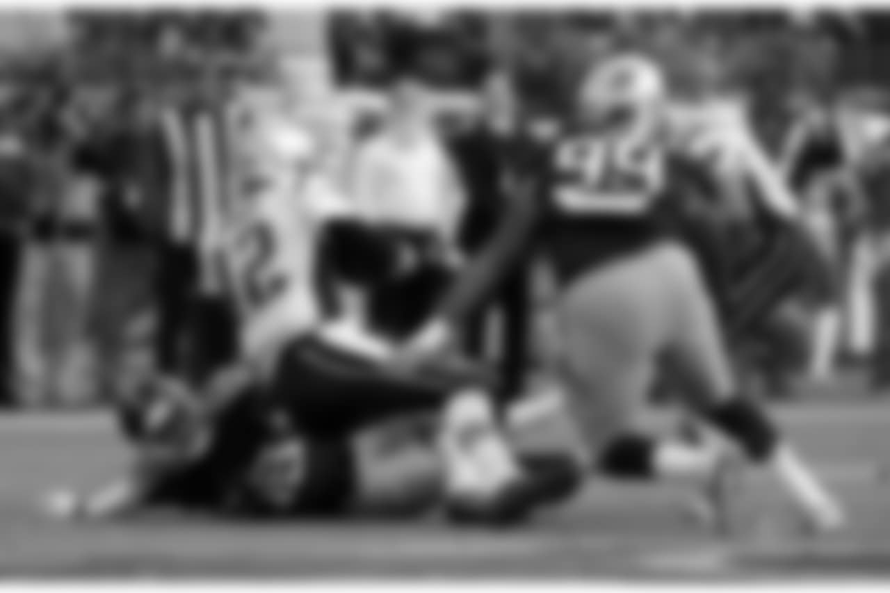 New England Patriots quarterback Tom Brady (12) is sacked for an 11-yard loss by Tennessee Titans linebacker Harold Landry (58) and defensive end Jurrell Casey (99) in the first half of an NFL football game Sunday, Nov. 11, 2018, in Nashville, Tenn. (AP Photo/James Kenney)