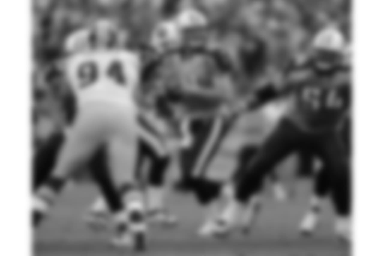 This Nov. 21, 2010 photo shows Tennessee Titans quarterback Rusty Smith, center, passing against the Washington Redskins in the fourth quarter of an NFL football game in Nashville, Tenn. Head coach Jeff Fisher said Smith will be the starting quarterback in place of Vince Young when the Titans play Houston on Sunday. Young will be placed on injured reserve and needs surgery on his hand.(AP Photo/Joe Howell)