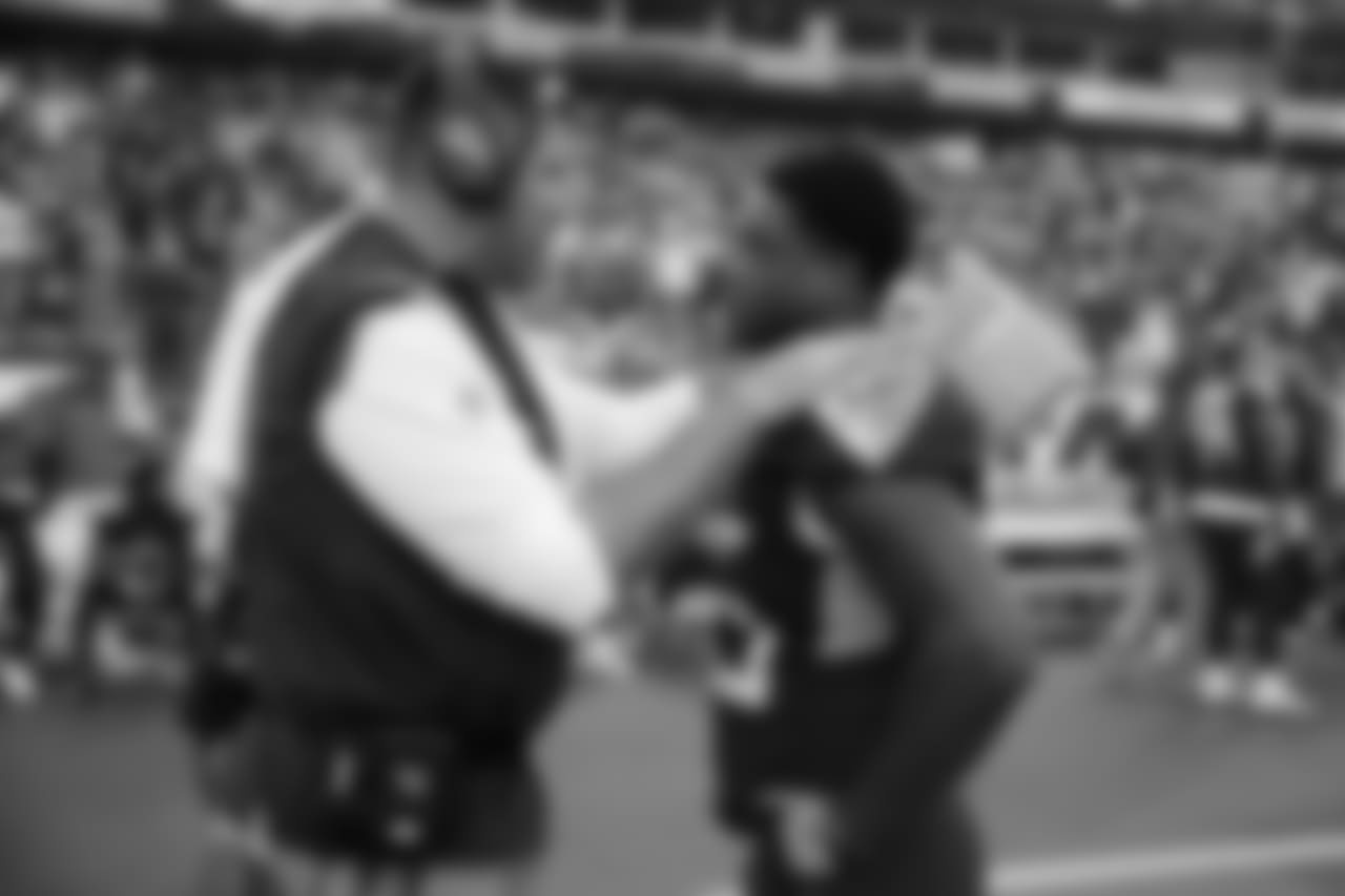 Tennessee Titans head coach Mike Vrabel talks with linebacker Jayon Brown before an NFL football game against the Baltimore Ravens Sunday, Oct. 14, 2018, in Nashville, Tenn. (AP Photo/James Kenney)