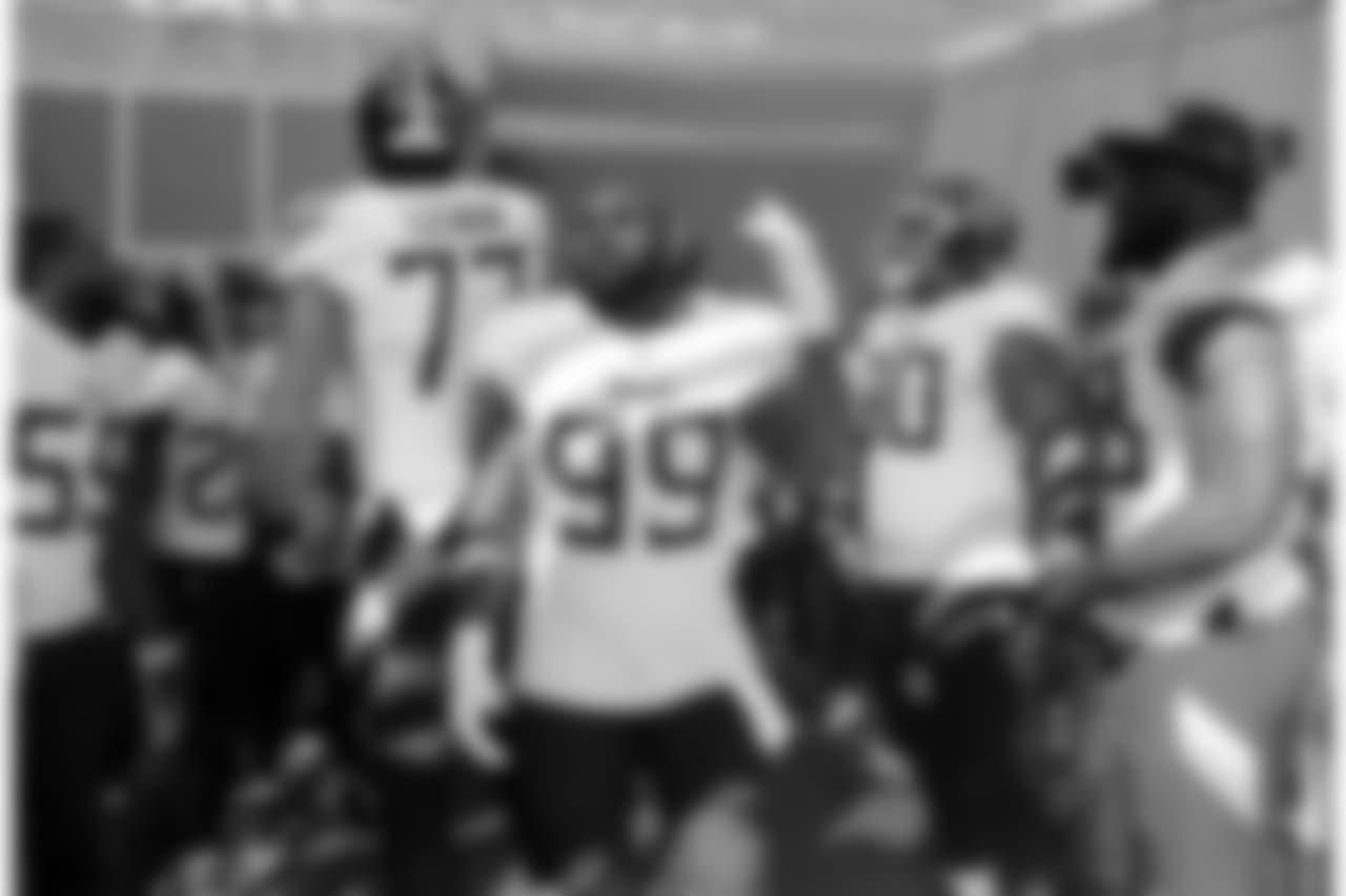 Tennessee Titans players including Taylor Lewan (77) and Jurrell Casey (99) get ready to take the field before an NFL football game against the Philadelphia Eagles Sunday, Sept. 30, 2018, in Nashville, Tenn. (AP Photo/James Kenney)