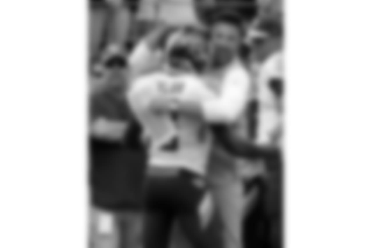 Tennessee Titans head coach Mike Vrabel celebrates with wide receiver Taywan Taylor (13) after Taylor scored a touchdown against the Houston Texans in the first half of an NFL football game Sunday, Sept. 16, 2018, in Nashville, Tenn. (AP Photo/Mark Zaleski)