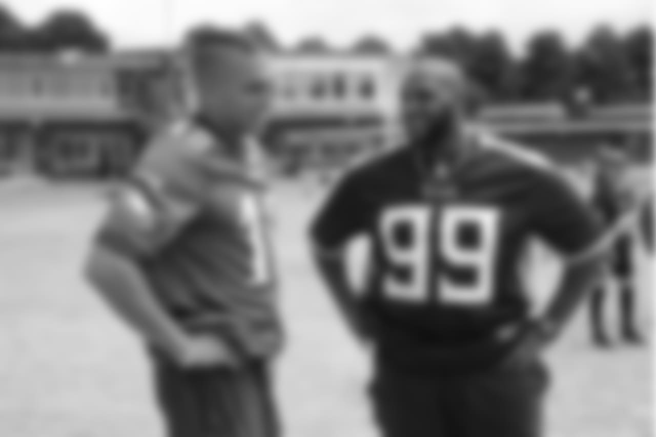Tennessee Titans' defensive end Jurrell Casey, right, chats with Philadelphia Eagles' wide receiver Mack Hollins as they give a video interview during an NFL flag schools event at King's House Sports Ground in Chiswick, west London, Wednesday, July 18, 2018. (AP Photo/Matt Dunham)