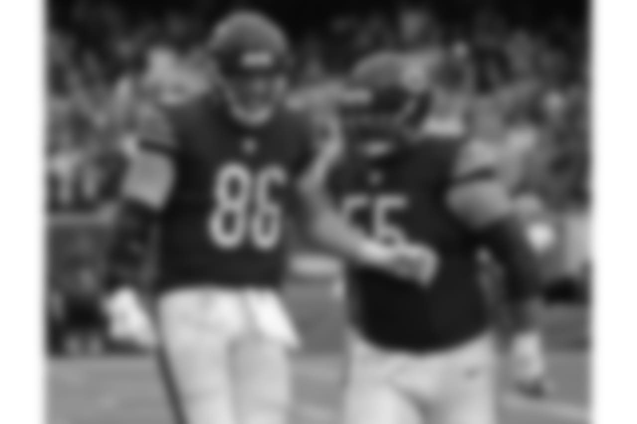 Chicago Bears tight end Zach Miller (86) celebrates a touchdown with center Hroniss Grasu (55) during the second half of an NFL football game against the Washington Redskins, Sunday, Dec. 13, 2015, in Chicago. (AP Photo/Nam Y. Huh)