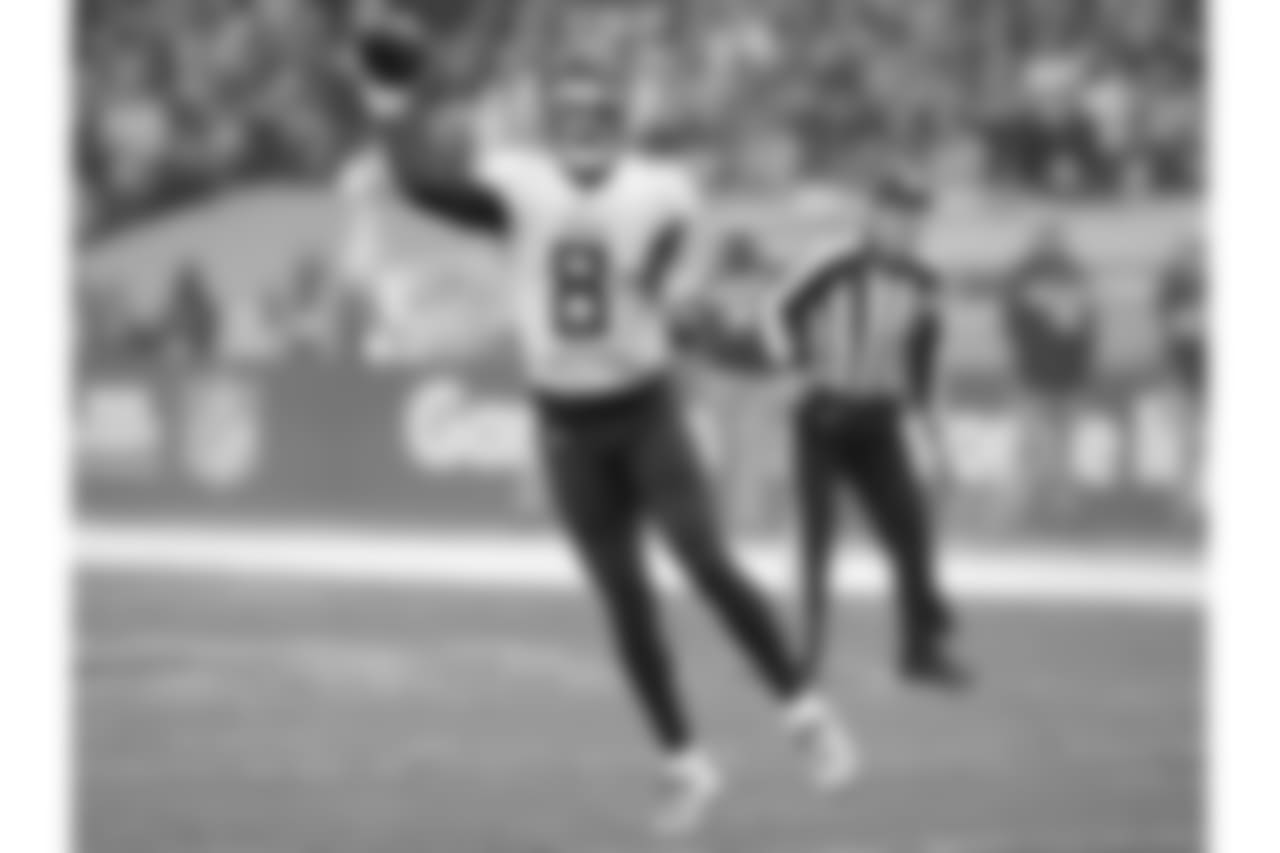 Tennessee Titans quarterback Marcus Mariota (8) passes the ball during the first half of an NFL football game against Los Angeles Chargers at Wembley stadium in London, Sunday, Oct. 21, 2018. (AP Photo/Matt Dunham)