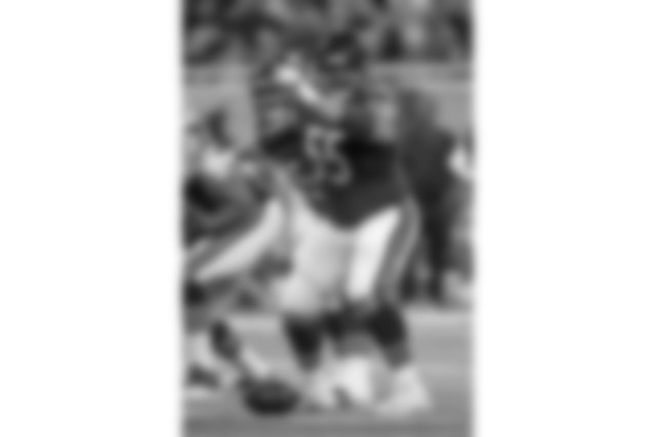 Chicago Bears offensive lineman Hroniss Grasu (55) signals at the line during the game against the Detroit Lions, Saturday Dec. 16, 2017, Detroit. The Lions defeated the Bears 20-10. (Al Tielemans via AP)