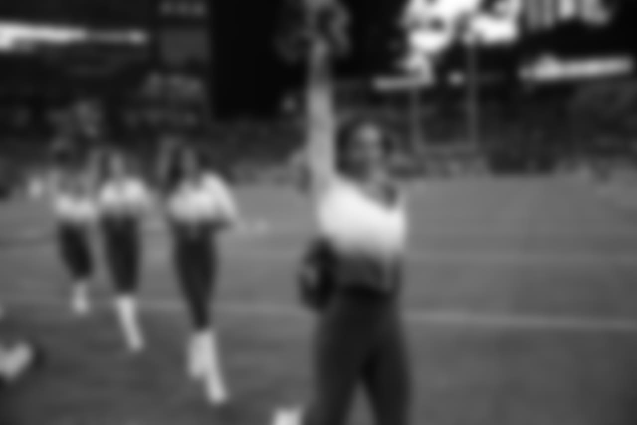 Tennessee Titans cheerleaders walks the turf the first half of an NFL football game between the Tennessee Titans and the Jacksonville Jaguars, Thursday, Dec. 6, 2018, in Nashville, Tenn. (AP Photo/James Kenney)