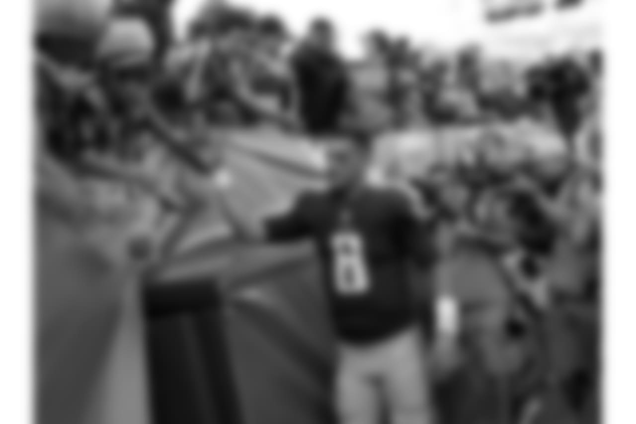 Tennessee Titans quarterback Marcus Mariota (8) slaps hands with fans after an NFL football game against the Baltimore Ravens Sunday, Nov. 5, 2017, in Nashville, Tenn. The Titans won 23-20. (AP Photo/James Kenney)