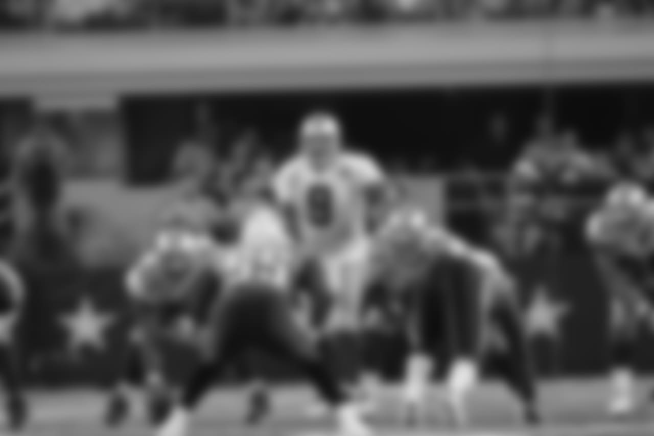 Dallas Cowboys quarterback Tony Romo (9) takes a snap during the second half of an NFL football game Sunday, Oct. 10, 2010 in Arlington, Texas. (AP Photo/Tim Sharp)