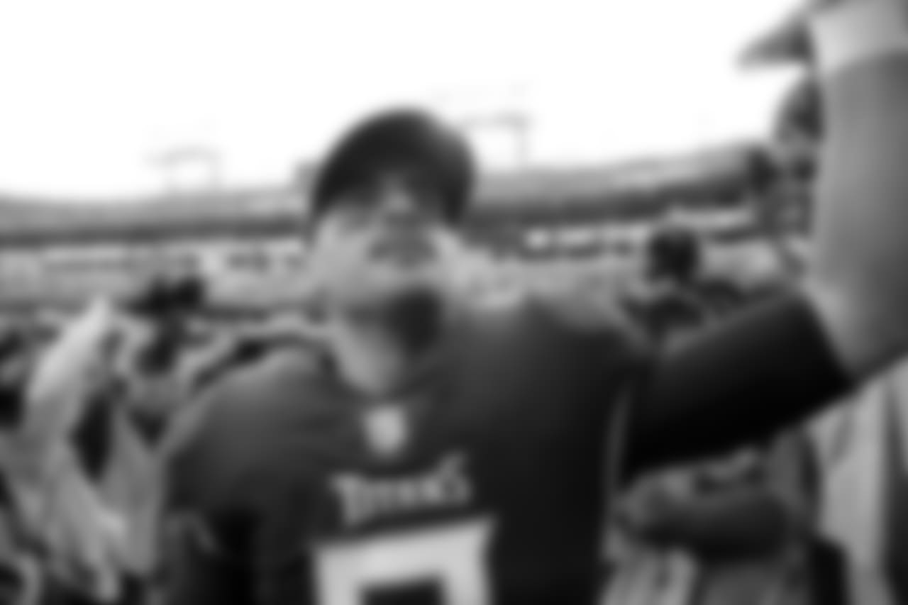 Tennessee Titans quarterback Marcus Mariota greets fans as he leaves the field after an NFL football game against the New England Patriots Sunday, Nov. 11, 2018, in Nashville, Tenn. The Titans won 34-10. (AP Photo/James Kenney)