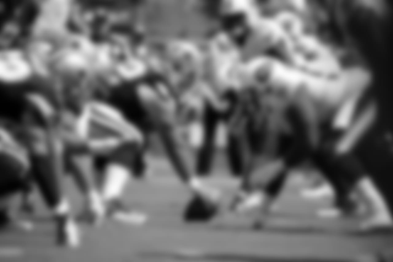 Dallas Cowboys center Travis Frederick (72) gets set to snap the ball at the line of scrimmage against the Tennessee Titans in the second quarter of an NFL football game Sunday, Sept. 14, 2014, in Nashville, Tenn. (AP Photo/Wade Payne)