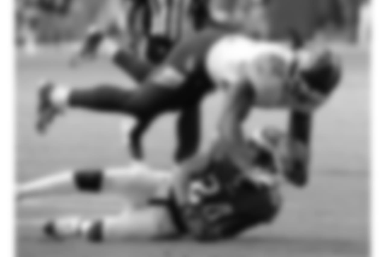 Tennessee Titans running back Derrick Henry (22) falls over Philadelphia Eagles defensive back Corey Graham (24) in the second half of an NFL football game Sunday, Sept. 30, 2018, in Nashville, Tenn. (AP Photo/Mark Zaleski)