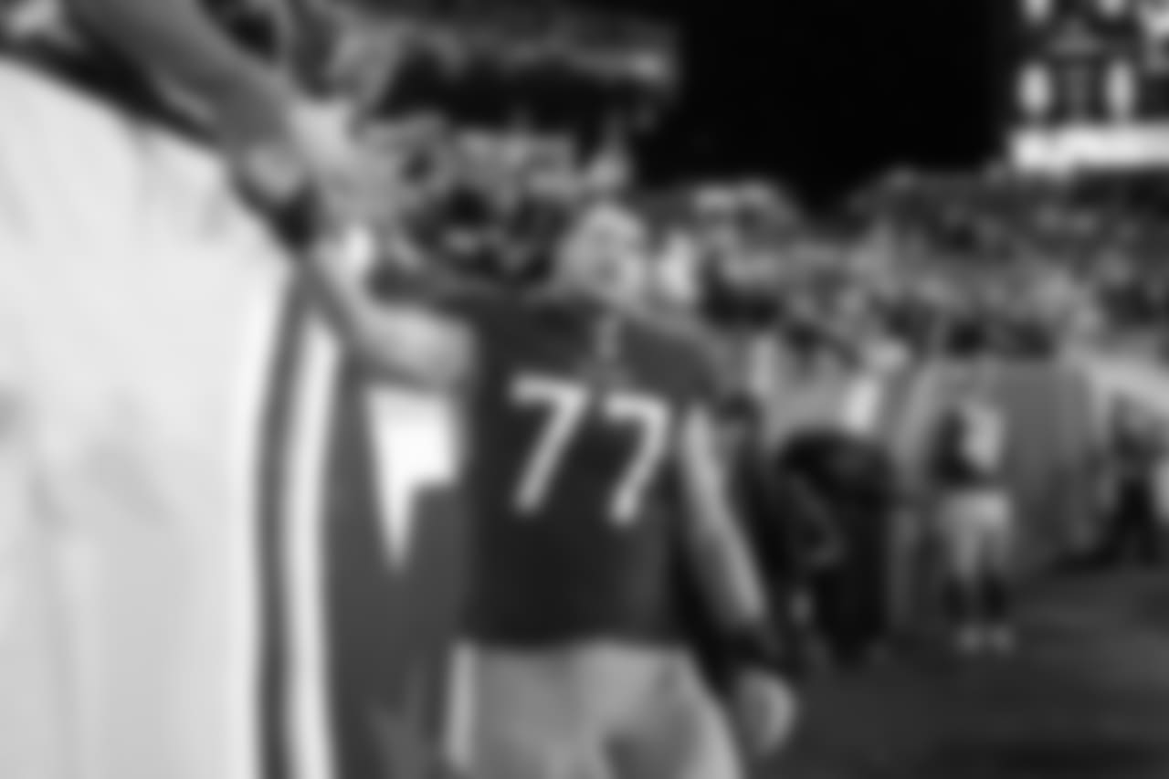 Tennessee Titans offensive tackle Taylor Lewan (77) shakes hands with fans as he leaves the field after an NFL football game against the Indianapolis Colts Sunday, Dec. 30, 2018, in Nashville, Tenn. The Colts won 33-17.(AP Photo/James Kenney)