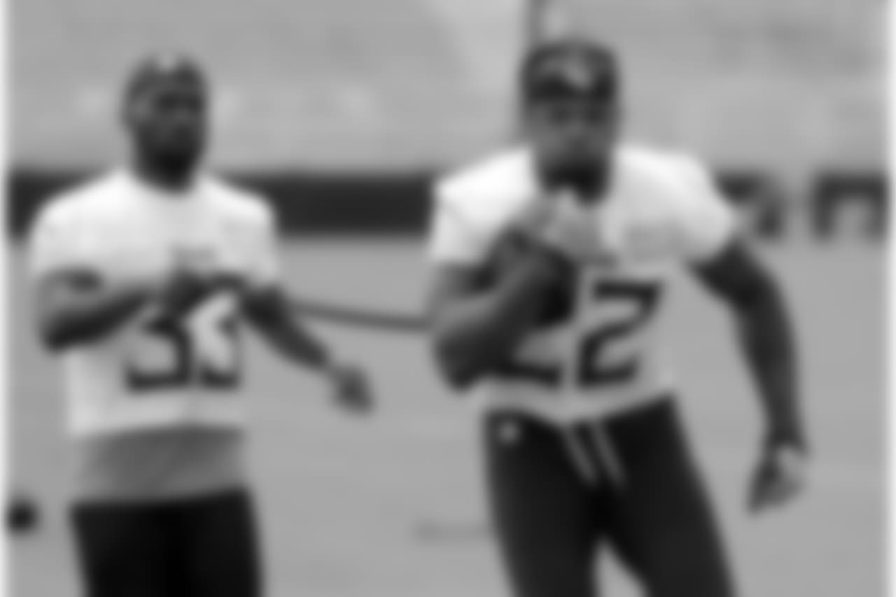 FILE - In this July 26, 2018, file photo, Tennessee Titans running back Derrick Henry (22) carries a ball tethered to a strap held by running back Dion Lewis (33) during NFL football training camp in Nashville, Tenn. Henry has a simple goal for this season as the 2015 Heisman Trophy winner chases his first starting job in the NFL: be dominant for the Titans. He won't define that by sharing any goals for yards or touchdowns, a smart move with veteran Dion Lewis also in the backfield. (AP Photo/Mark Humphrey, File)