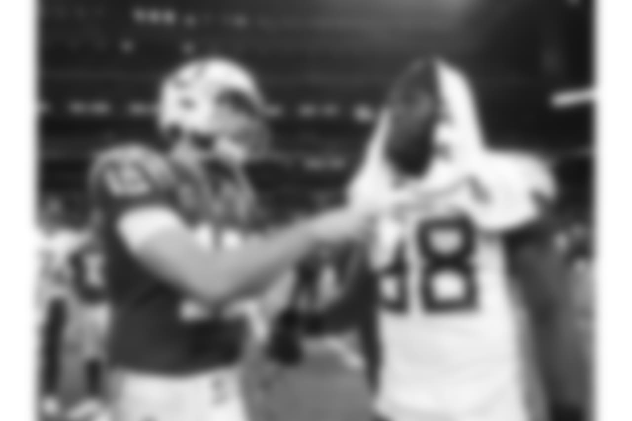 Indianapolis Colts quarterback Andrew Luck (12) talks with Tennessee Titans' Brian Orakpo following an NFL football game, Sunday, Nov. 18, 2018, in Indianapolis. Indianapolis won 38-10. (AP Photo/Jeff Roberson)