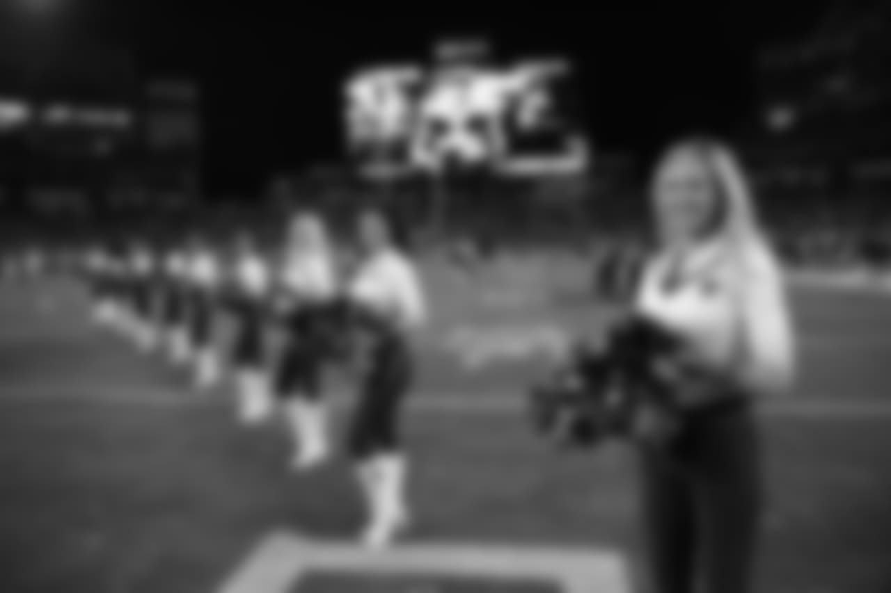 Tennessee Titans cheerleaders walks the turf the first half of an NFL football game between the Tennessee Titans and the Jacksonville Jaguars, Thursday, Dec. 6, 2018, in Nashville, Tenn. (AP Photo/James Kenney)