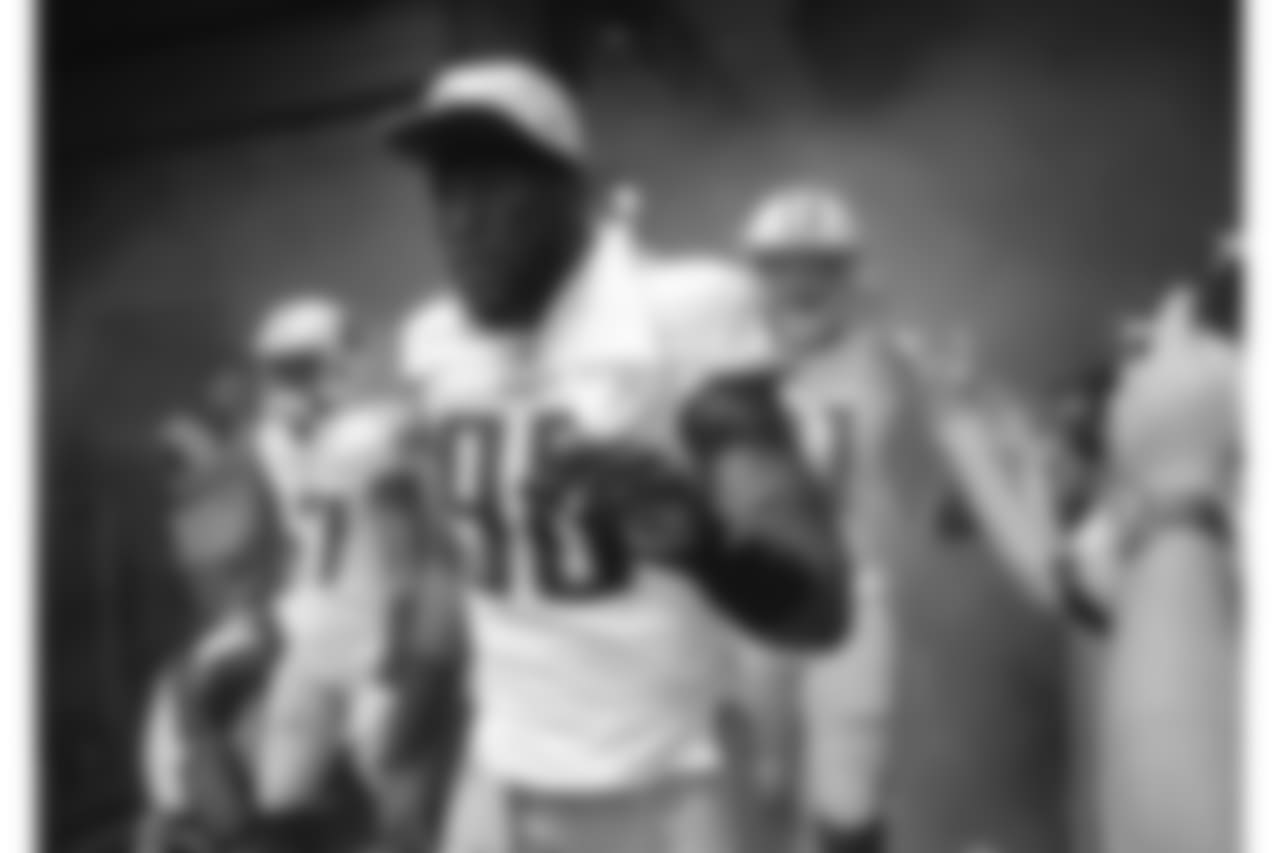 Tennessee Titans outside linebacker Brian Orakpo (98) walks past fans as he heads to the field for an NFL football preseason game against the Chicago Bears Sunday, Aug. 27, 2017, in Nashville, Tenn. (AP Photo/James Kenney)