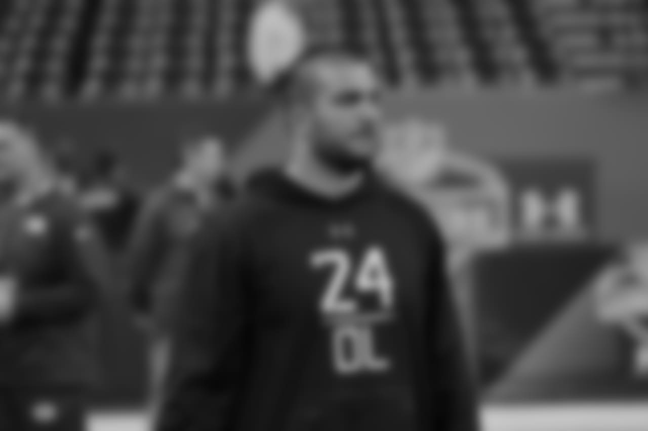 Oregon offensive lineman Hroniss Grasu watches players warm up at the NFL football scouting combine in Indianapolis, Friday, Feb. 20, 2015. (AP Photo/David J. Phillip)