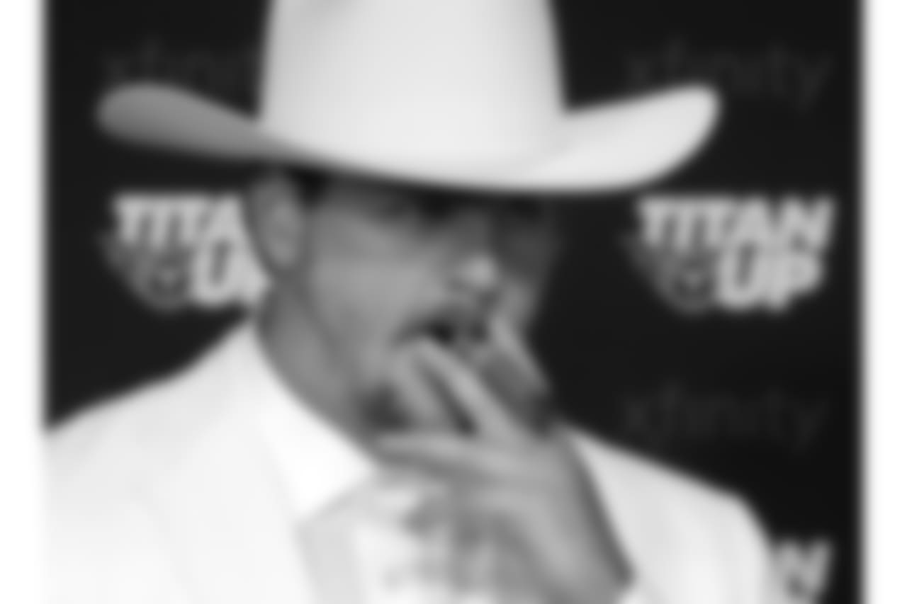 Tennessee Titans offensive tackle Taylor Lewan appears at a news conference dressed as Boss Hogg, a character from the television series "The Dukes of Hazard," after a practice during NFL football training camp Friday, July 27, 2018, in Nashville, Tenn. Lewan, a two-time Pro Bowl player, signed a contract extension reportedly worth $80 million with $50 million guaranteed on Friday, making him the NFL's highest-paid offensive lineman to date. (AP Photo/Mark Humphrey)