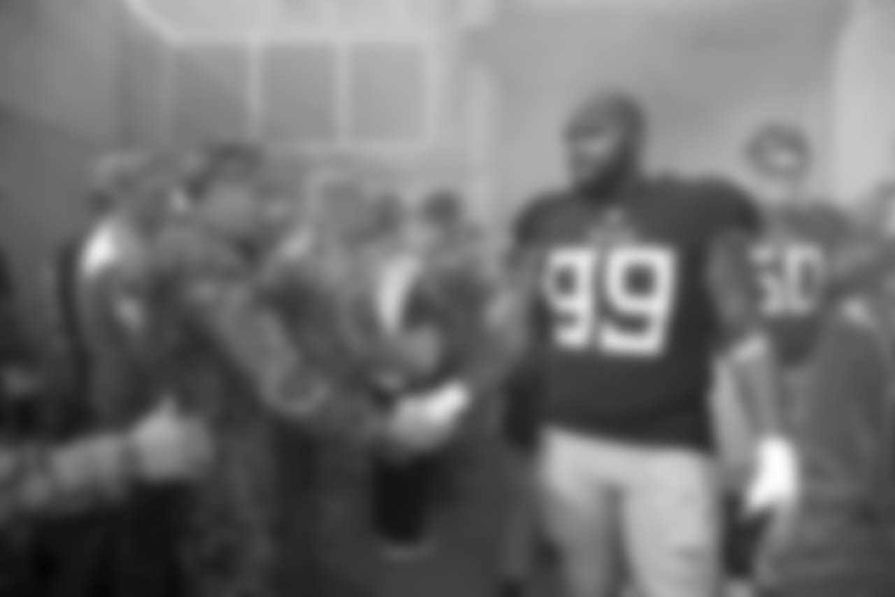 Tennessee Titans defensive end Jurrell Casey (99) shakes hands with a soldier before an NFL football game between the Titans and the New England Patriots Sunday, Nov. 11, 2018, in Nashville, Tenn. (AP Photo/James Kenney)