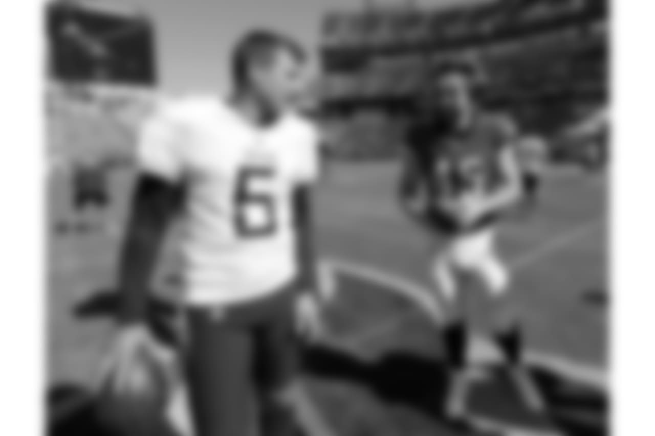 Tennessee Titans punter Brett Kern (6) talks with Philadelphia Eagles long snapper Rick Lovato (45) before an NFL football game Sunday, Sept. 30, 2018, in Nashville, Tenn. (AP Photo/Mark Zaleski)