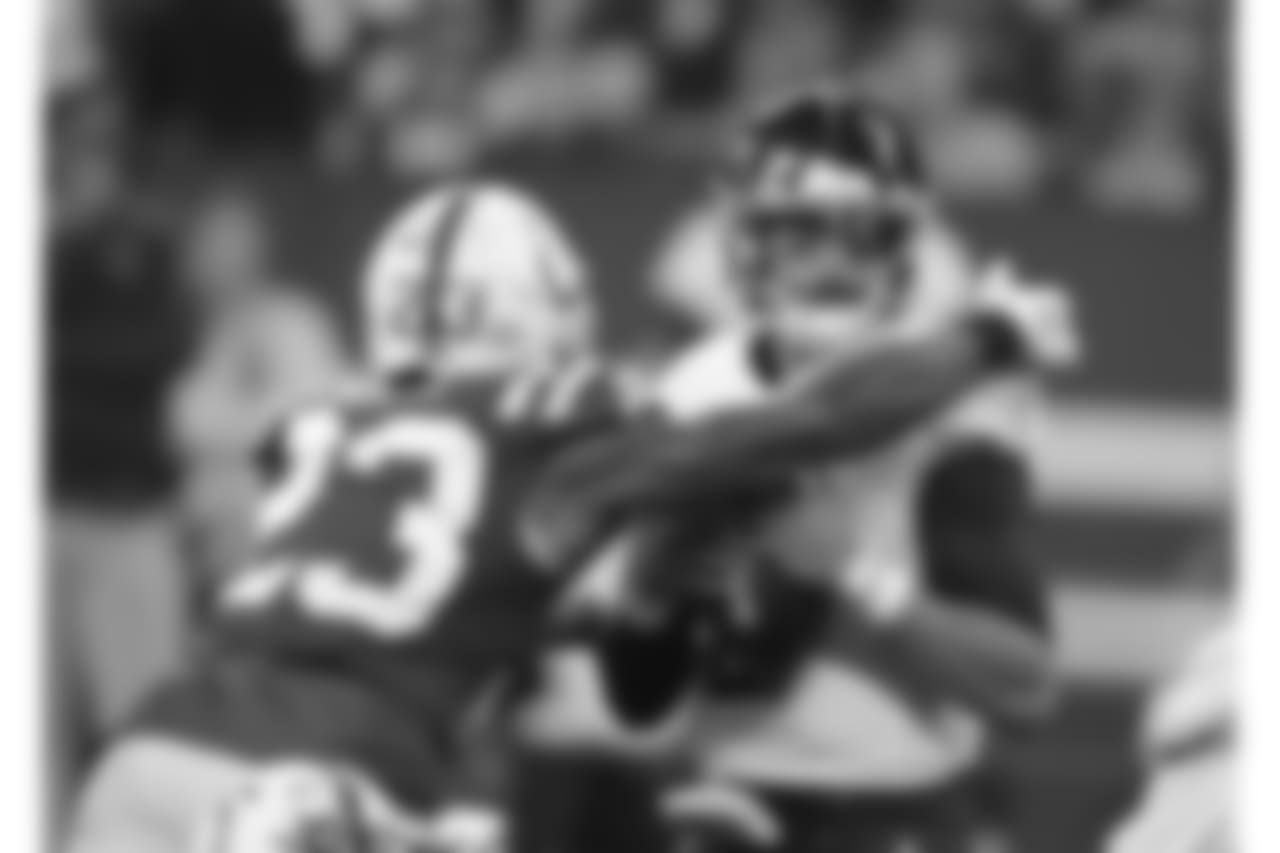 Tennessee Titans quarterback Marcus Mariota (8) is sacked by Indianapolis Colts' Kenny Moore (23) during the first half of an NFL football game, Sunday, Nov. 18, 2018, in Indianapolis. (AP Photo/Darron Cummings)
