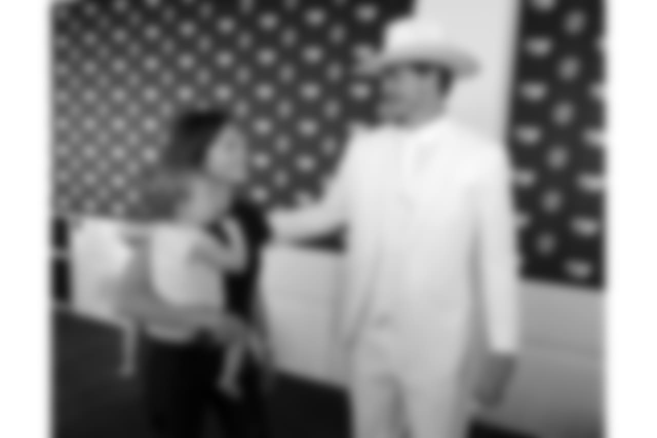 Tennessee Titans offensive tackle Taylor Lewan, dressed as Boss Hogg, a character from the television series "The Dukes of Hazard," leaves with his wife, Taylin, and daughter, Wynne, 1, after a news conference at NFL football training camp Friday, July 27, 2018, in Nashville, Tenn. Lewan, a two-time Pro Bowl player, signed a contract extension reportedly worth $80 million with $50 million guaranteed on Friday, making him the NFL's highest-paid offensive lineman to date. (AP Photo/Mark Humphrey)
