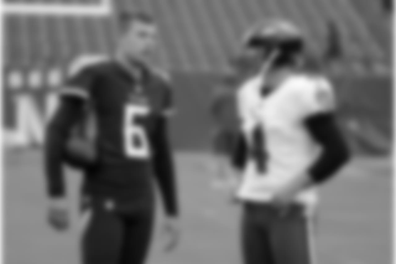 Tennessee Titans punter Brett Kern (6) talks with Baltimore Ravens punter Sam Koch (4) before an NFL football game Sunday, Oct. 14, 2018, in Nashville, Tenn. (AP Photo/James Kenney)