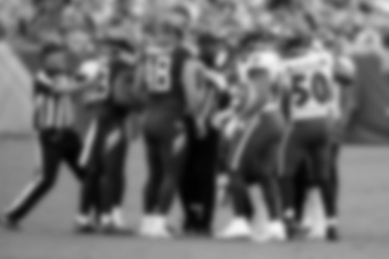 Tennessee Titans and Baltimore Ravens players are separated in the first half of an NFL football game Sunday, Oct. 14, 2018, in Nashville, Tenn. (AP Photo/James Kenney)