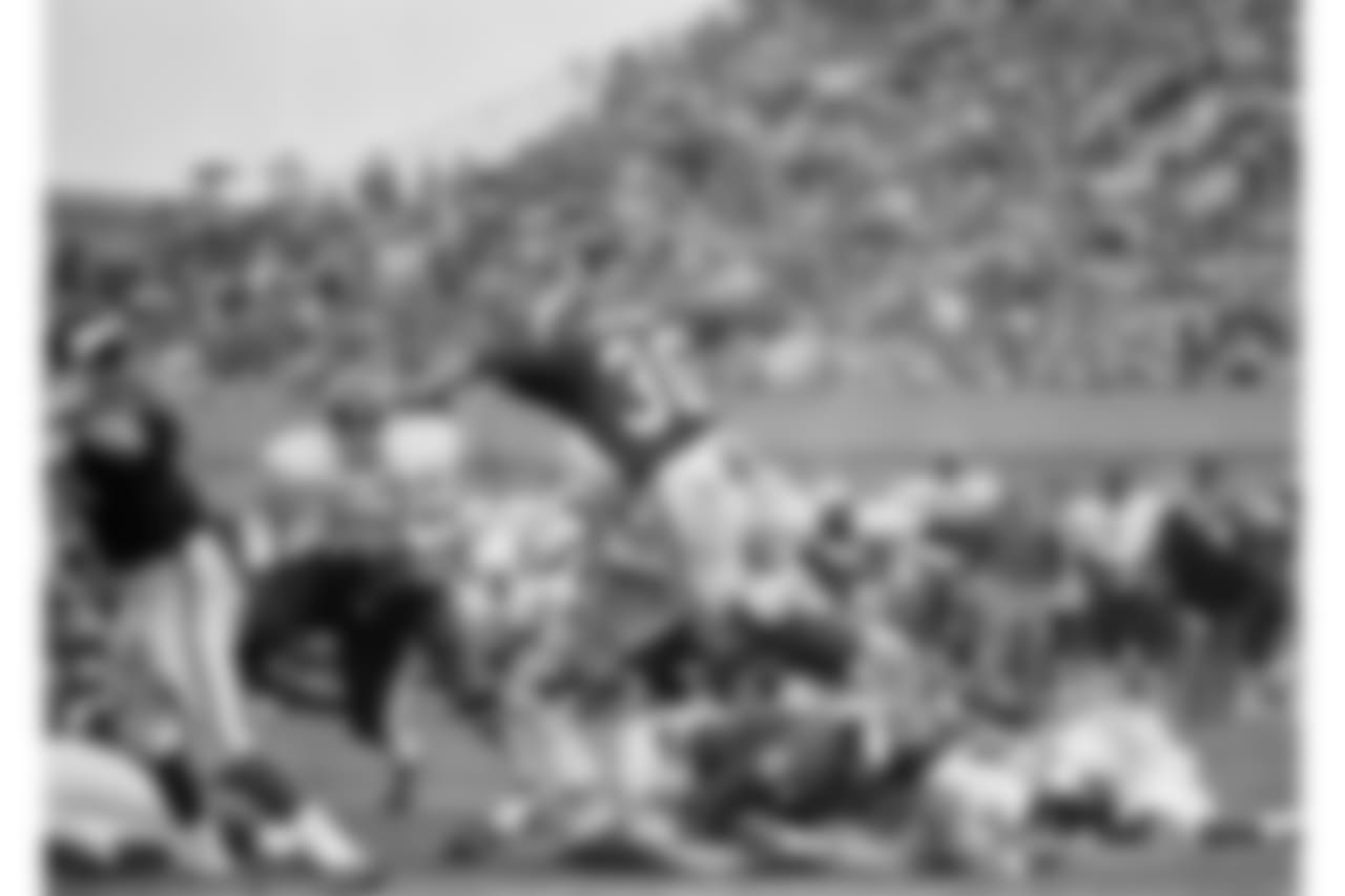 Minnesota Vikings ball carrier Bill Brown leaps over linemates for 2-yard gain against the Kansas City Chiefs in Minneapolis, on Sunday, Sept. 20, 1970 during National Football Conference game in Twin Cities Chief?s Willie Lanier (63) waits for Brown while Vikings Milt Sunde (64) falls on Chiefs player. (AP Photo/RW)