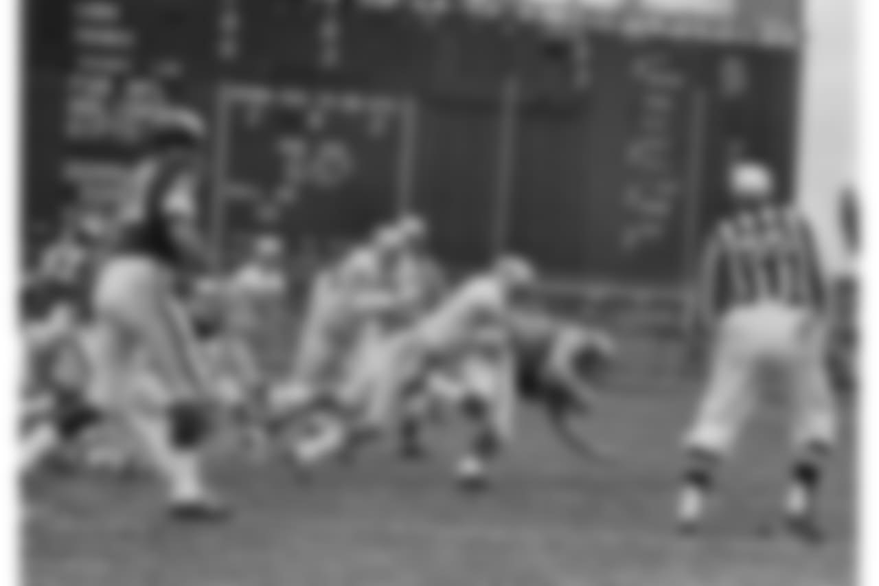 Detroit Lions Mike Lucci (53) dumps Minnesota Viking Ball carrier Bill Brown for a 2-yard gain in first half of NFL game in Twin Cities at Minneapolis, on Sunday, Nov. 12, 1967. Minnesota and Detroit tied, 10-10. (AP Photo/RW)