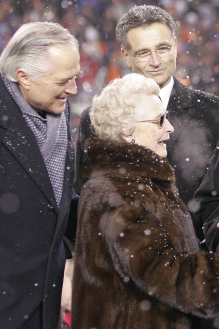 Chicago Bears chairman Michael McCaskey, left, and owner Virginia McCaskey  , center, react as they are presented with the George Halas Trophy after  the Bears beat the New Orleans Saints, 39-14, to