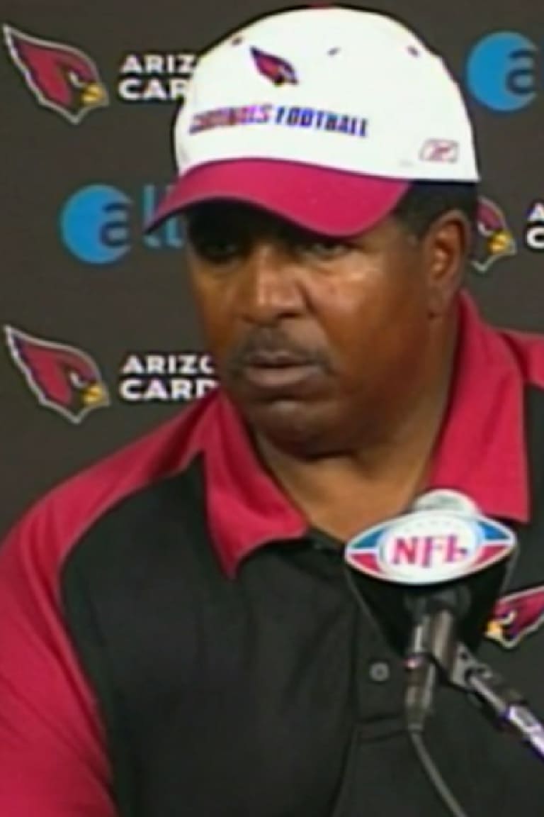 Arizona Cardinals head coach Dennis Green heads off the field at