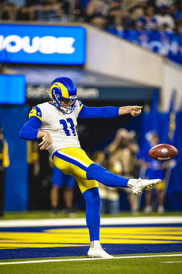 Los Angeles Rams punter Riley Dixon (11) throws a pass on a trick play in  the first half of an NFL football game against the Dallas Cowboys, Sunday,  Oct. 9, 2022, in