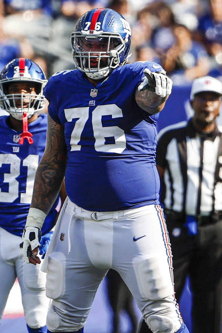 New York Giants guard Jon Feliciano (76) takes the field for an